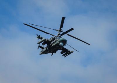 A Russian Ka-52 "Alligator" attack helicopter flies over Panteleimonivka