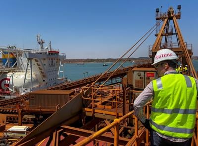 FILE PHOTO: A visitor to Rio Tinto's Dampier Port operations views a bulk carrier ship powered by liquid natural gas, Port Dampier