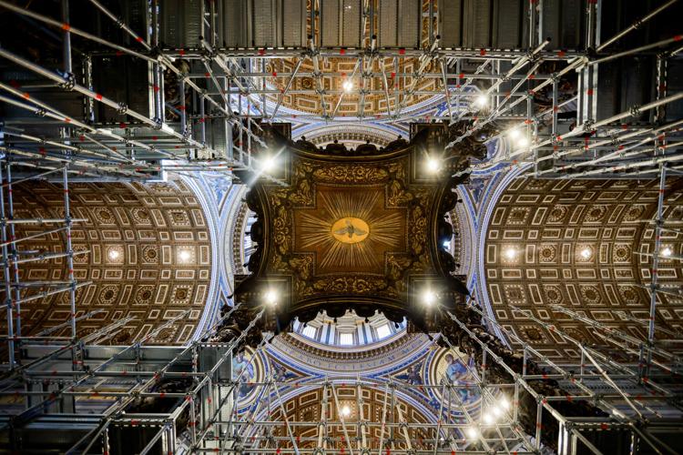 A view of scaffolding around a baroque sculpted bronze canopy by Gian Lorenzo Bernini over the high altar of St. Peter's Basilica in preparation for its restoration, at the Vatican