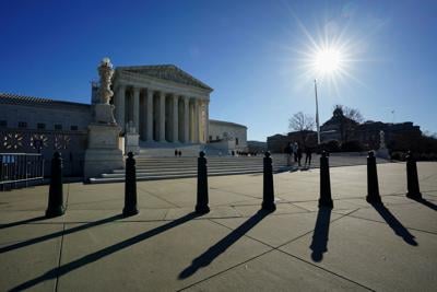 FILE PHOTO: The sun rises over the U.S. Supreme Court in Washington